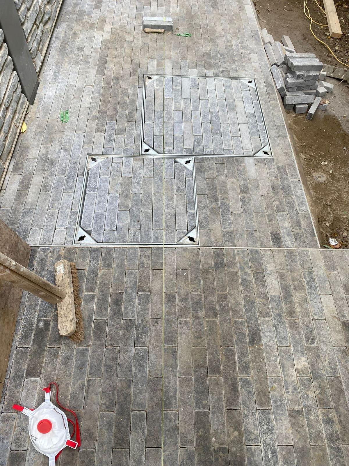 Block paving with recessed covers after